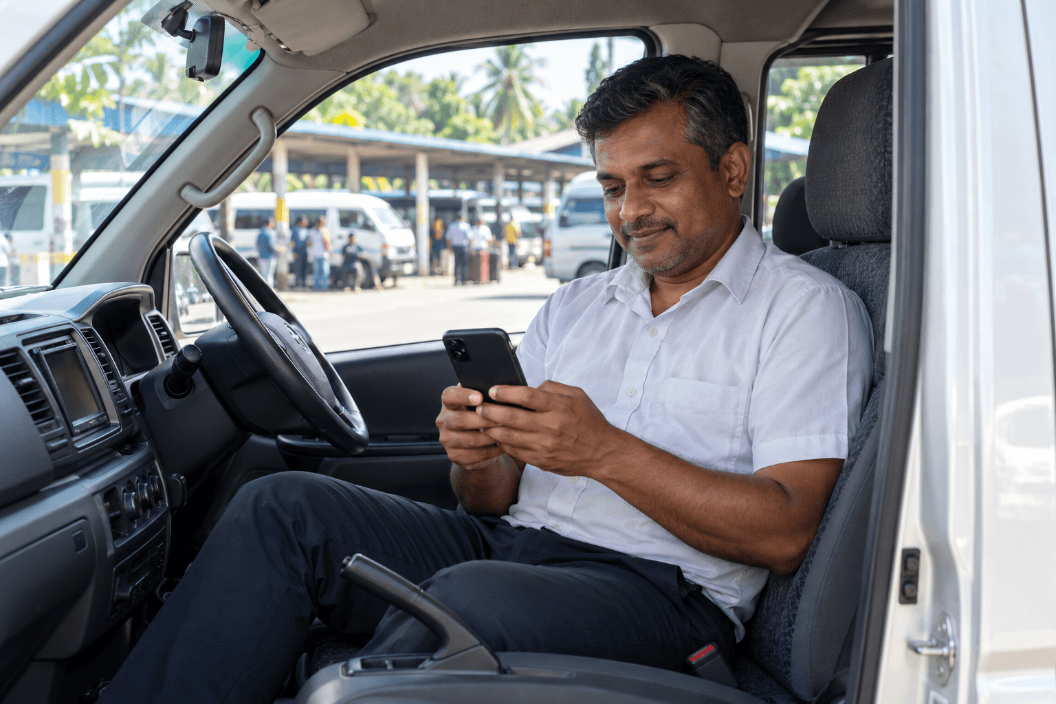 Sri Lankan driver enjoying a shared intercity journey